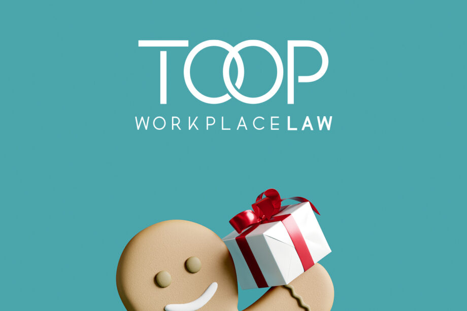 Gingerbread man holding a xmas gift, below the Toop Workplace Law logo